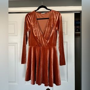 Salmon colored velvet skater style dress.